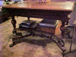 Merklen table — hunzinger library table with griffins and lion head feet